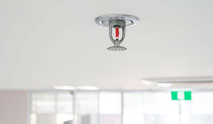 Fire sprinkler head installed on a commercial ceiling