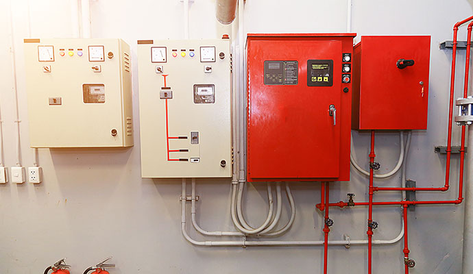 Wall mounted electrical and red fire control panels