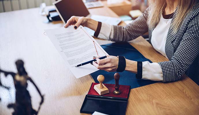 Notary public reviewing legal documents