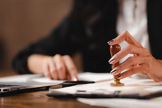 Paper agreements at desk of notary
