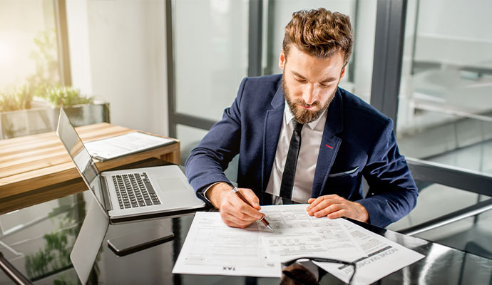 Professional reviewing income tax forms