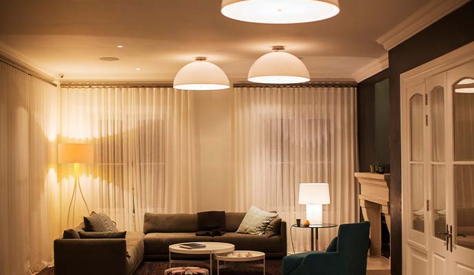 A modern luxury living room illuminated by warm light