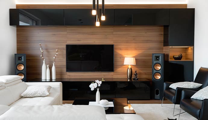 Modern living room with tower speakers and TV