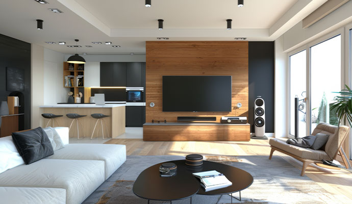 Open living and kitchen area with home audio speakers and a soundbar.