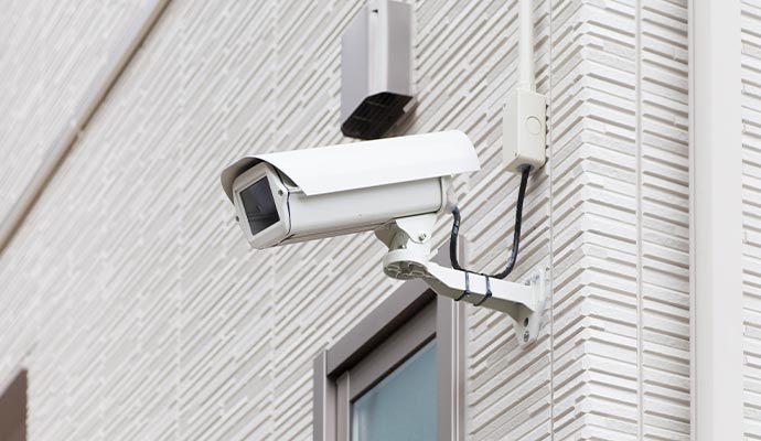 Outdoor security camera above wall installed