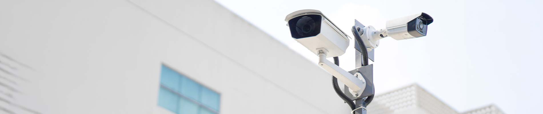Outdoor security cameras on a commercial building