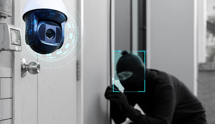 Security camera detecting intruder at front door