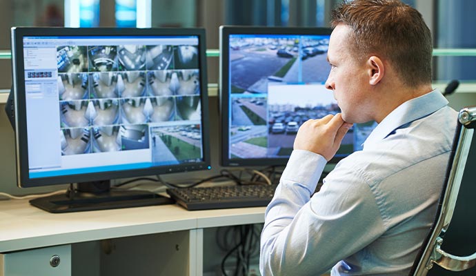 Security operator monitoring cctv surveillance control room