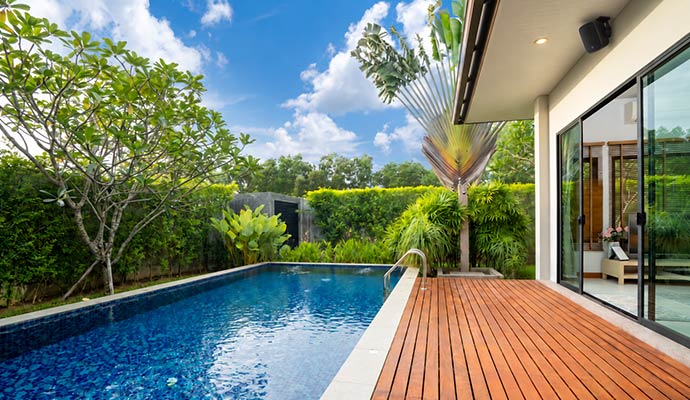 Swimming pool and deck with outdoor speaker