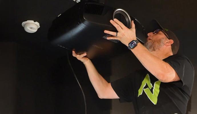 Technician installing a home theater projector