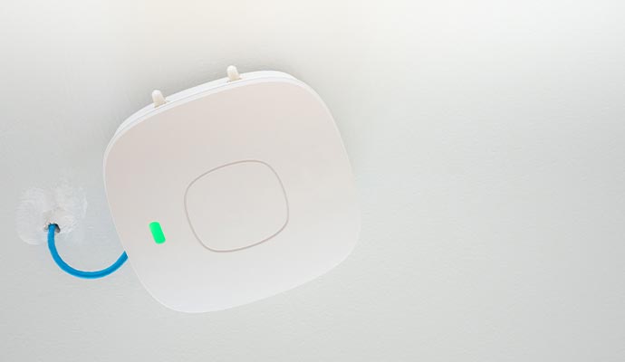 Wireless network access point installed on a ceiling